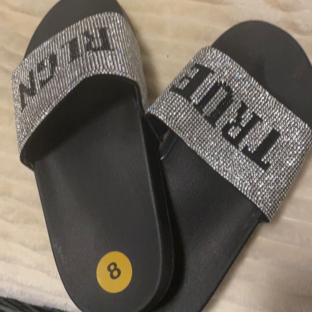 Brand new diamond and black True Religion slipper great for a Christmas gift